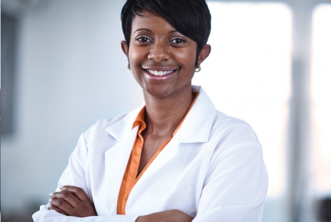 A pharmacist in a lab coat
