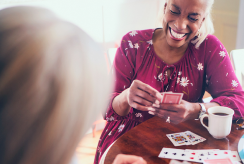 Image of an woman playing cards